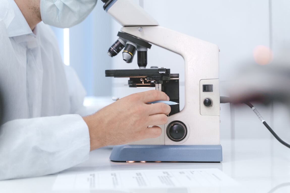 Medical Professional using Microscope